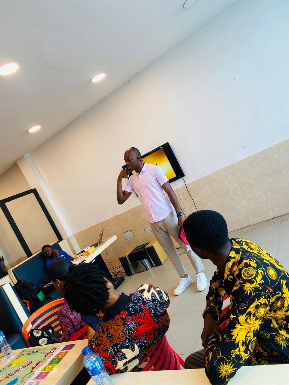 A BGDC facilitator speaking at a design workshop in Asaba